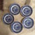 A timeless set of five vintage Blue Willow plates, featuring the iconic chinoiserie landscape with pagodas, bridges, and...