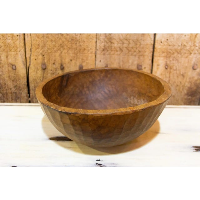 A beautiful rustic hand-hewn wooden water bowl made by the nomadic people of Nepal. Its crafted from a single piece of...