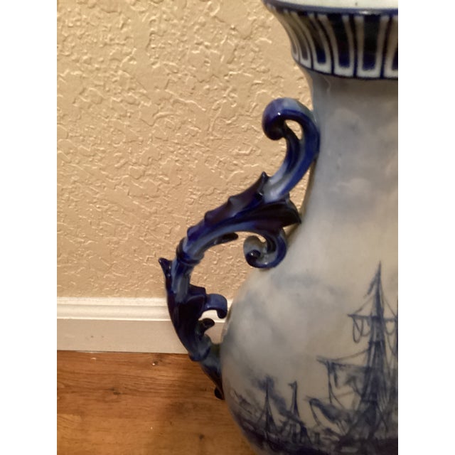 Stunning vase in delft style. This piece is very old and elegant. It follows the beautiful blue and white coloring of the...