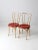 A pair of antique bentwood café chairs featuring classic, timeless lines. Each chair retains its original cream and red...