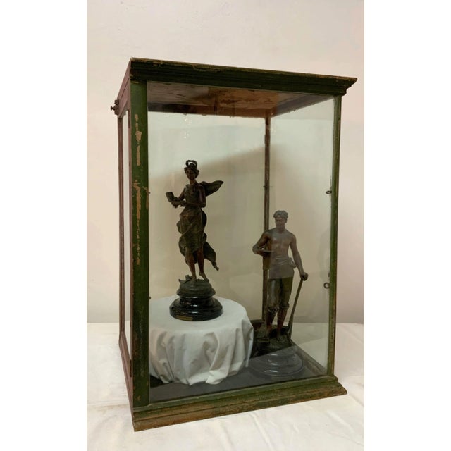 Extraordinary 19th Century metal and glass display case. The sturdy metal frame was painted at some point, giving this...