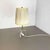 Article: Tripod table light. Origin: Austria Age: 1950s. This original vintage tripod table light was designed and...