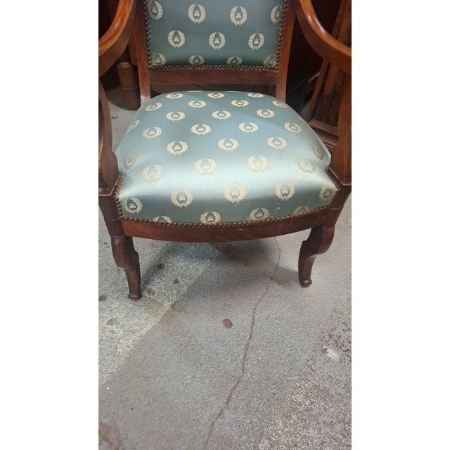 Pair of Restoration period armchairs, not identical. They can be purchased separately. The seats and upholstery are in...