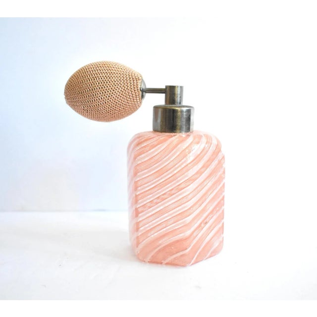 A vintage, c. 1940s-1950s Murano, Italy art glass perfume bottle with a hexagonal shape and swirled pink and white...