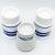 Elegant set of 3 porcelain candle holders by Dansk. 2 larger each measure 3.25”D, 4.25”H Small measures 3”D, 3.75”H