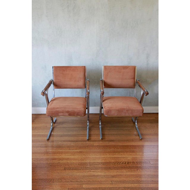 Stunning pair of Mid-Century Modern lounge chairs in the manners of Cleo Baldon , Featuring iconic chrome tubular framing,...