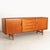A danish midcentury credenza designed by k.b. Simonsen for faarup møbelfabrik, circa 1965, crafted in richly toned teak...