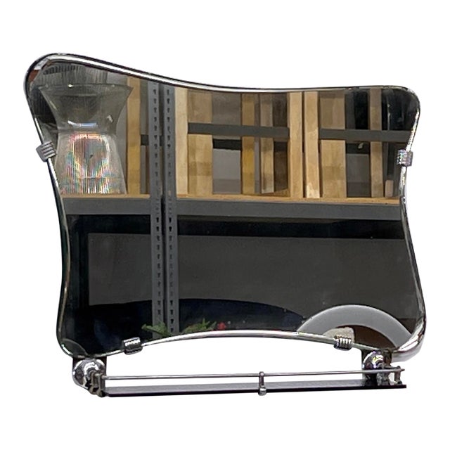 Talk about a statement piece! This 1940s Italian mirror is an absolute showstopper—with its asymmetrical, amoeba-like...