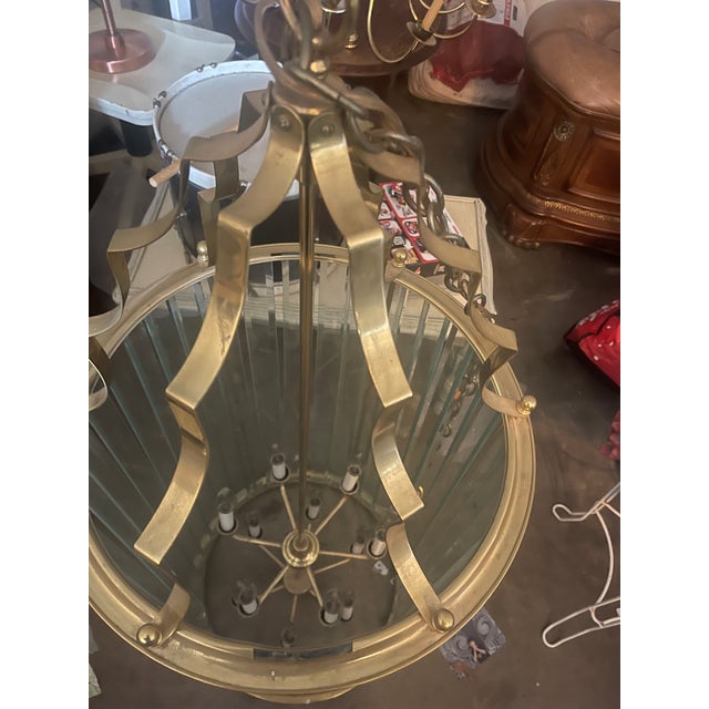)While it mimics the classical shapes of an 18th-century French Directoire or English Georgian hall lantern, it is firmly...