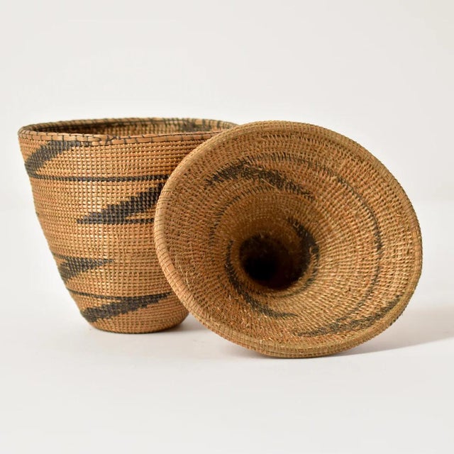 The Tutsi Tight Weave Basket with Lid from Rwanda epitomizes the artistry and tradition of the Tutsi community's weaving...