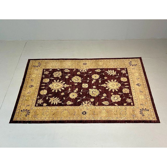 Indian, Wool Carpet, Area Rug, Burgundy and Beige, 21st Century The whole having a very rich burgundy color flanked by...