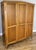 This elegant Vintage French Louis wardrobe presents classic styling with a warm oak finish, graceful lines, and refined...