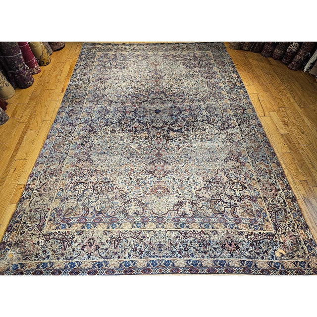 A magnificent Late 19th century oversized Persian Kerman Lavar rug handwoven in the 4th quarter of the 1800s. This rug...
