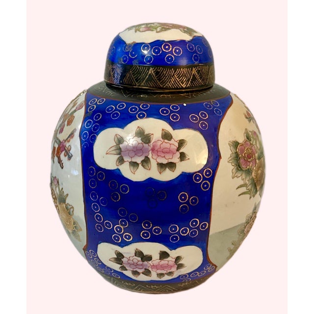 Vintage Hand Painted Lidded Chinese Ginger Jar. Floral design against a vivid blue back drop. This is a very striking...