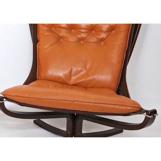 A wonderful pair of falcon armchairs with loose, tufted cushions designed by sigurd resell. this design duo is upholstered...