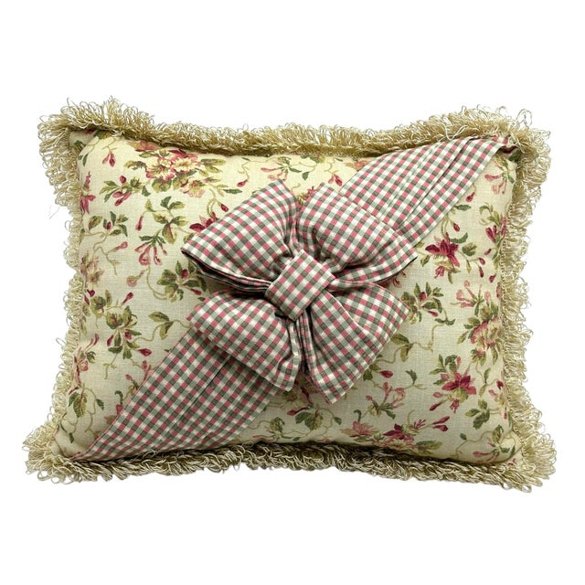 Vintage Floral decorative pillow. Beige pillow with floral reds and a plaid bow that adorns the front of the pillow to...