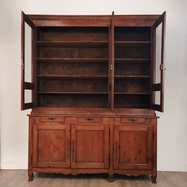 A rare Louis Philippe large cherry two-part cabinet, France circa 1840.