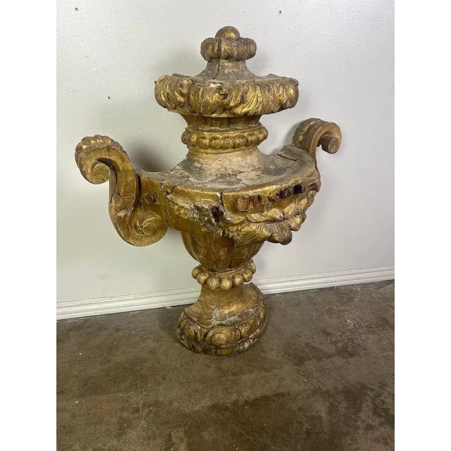 Early 19th century monumental Neoclassical style Italian gilt wood urn, detailed with acanthus leaves, scrolled arms and...