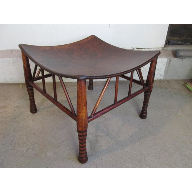 Antique English Egyptian Revival Thebes stool attributed to Liberty & Co., London. Maple frame with bentwood seat....