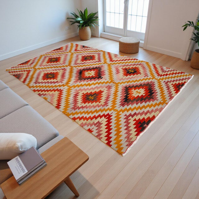 Vibrant mid-century Barak tribe kilim from Antalya, handwoven in the 1970s with bold zigzag diamond medallions and...