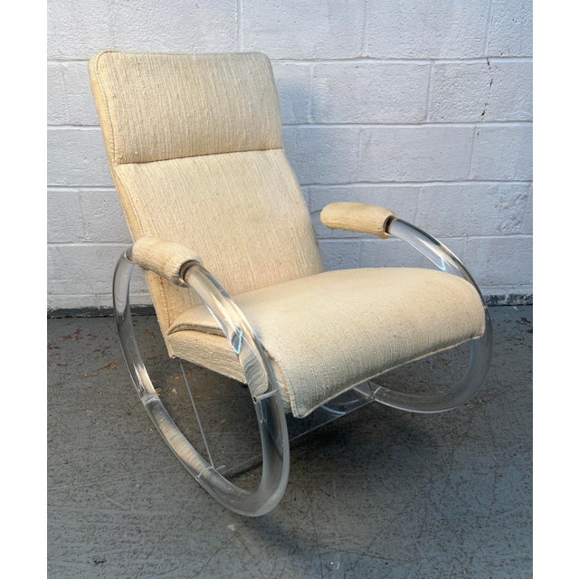 An iconic example of Hollywood Regency and Mid-Century Modern design, this vintage Lucite rocking chair by Charles Hollis...