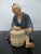 Vintage Japanese Hakata Urasaki clay doll figurine of elder man seated playing drum. Collectible Japanese statue dating...