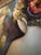 Vintage framed oil painting on canvas of a female figure viewed from behind. The scene is a nude woman with her hair up,...