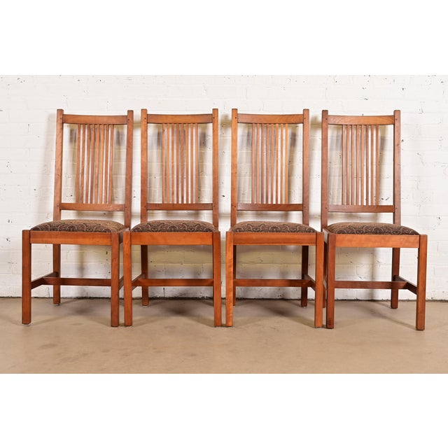 An exceptional set of four Mission or Arts & Crafts style spindle back side chairs or dining chairs By L. & J.G. Stickley...