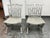 Design Plus Gallery presents a pair of Regency Reproduction Side Chairs. The gray painted wood displays a distressed...