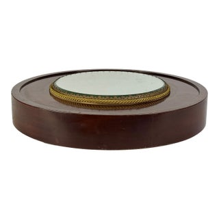 Fancy Antique Rounded Mirrored Plateau Gallery Tray Sitting Atop a Brass Inlaid Mahogany Platform For Sale