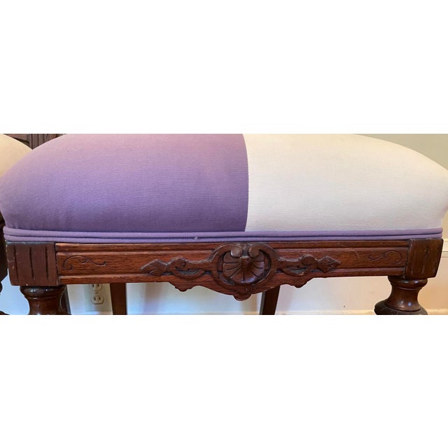 A charming matched pair of Victorian ladies' chair, full of the elegance and refined craftsmanship that defined 19th-...
