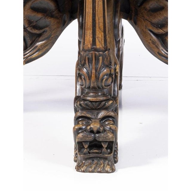 Dining room table portuguese end 19th century in chestnut wood. Standing on four carved wooden feet with a zoomorphic...