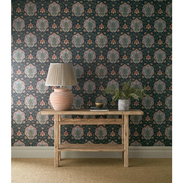 Retaining the striking shield motif of the original document Iris & Rose celebrates both flowers in a richly ornamental...