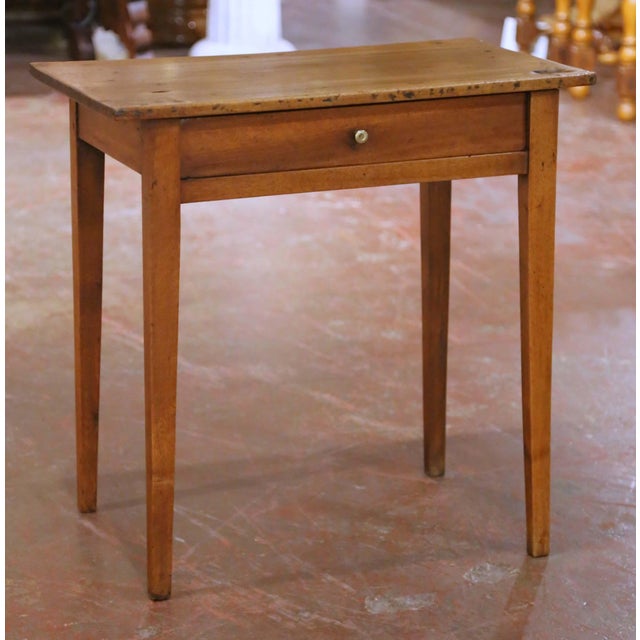 Crafted in France circa 1860, this antique Louis Philippe side table offers clean lines and timeless simplicity, making it...