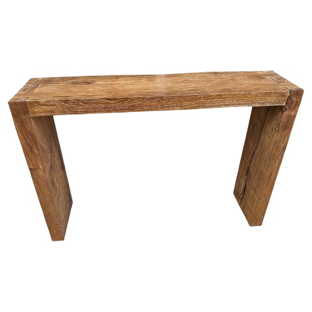 Impressive three inch thick minimalist console table hand made from reclaimed teak wood. One side is straight and the...