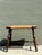 Bring a touch of rustic elegance to your interior with this charming vintage Early American style low stool. Expertly...