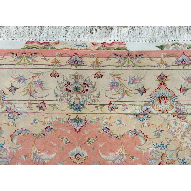 A remarkable late 20th century Persian Tabriz hand-knotted silk and wool rug with a mesmerizing pattern with a central...