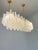 Elegant and contemporary “Conchiglie” chandelier in matt Gold 24k finishing. Very bright and lively Murano glass for...