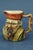 Description of the object: Extremely rare small glazed terracotta jug or milk jug, anthropomorphic in shape, depicting the...