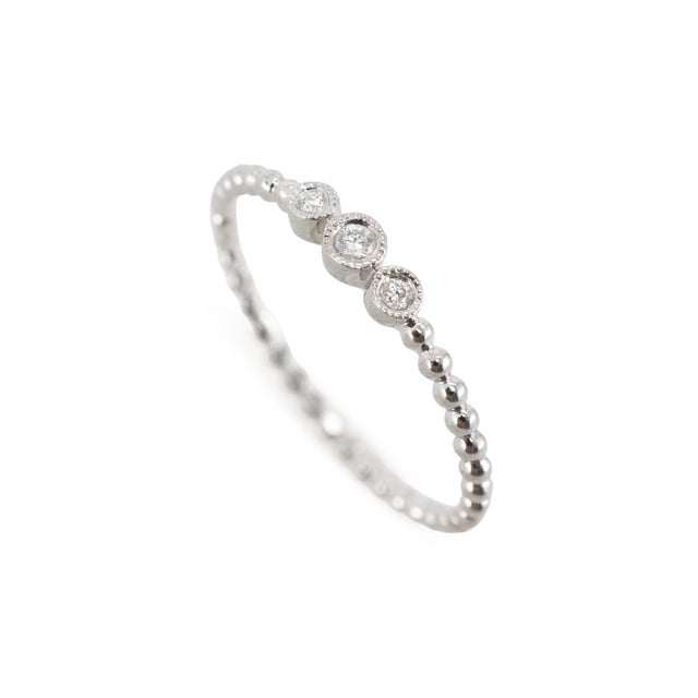 Gender: Ladies Metal Type: 14K White Gold Ring Size: 7 Width: 1.50 mm Weight: 1.03 grams Ladies 14K white gold, diamond...