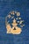 Antique Chinese peking rug, circa 1920–1940, featuring a rich sapphire blue field centered with a traditional floral...