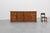 A substantial french oak sideboard by de tonge, distinguished by its architectural façade of four arched raised-panel...