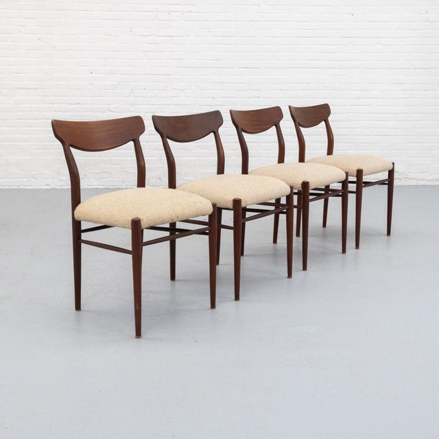 Set of four dining chairs by Lübke, Germany, 1960s. Slim design with gently curved back supports and a wide, elegantly...