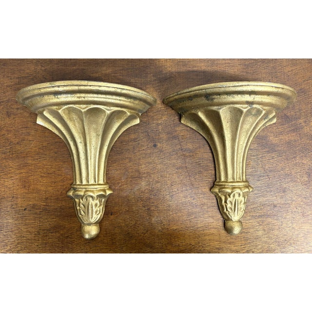 This is a gorgeous pair of vintage neoclassical-style wall shelves / corbels with a distressed gold finish and fluted...