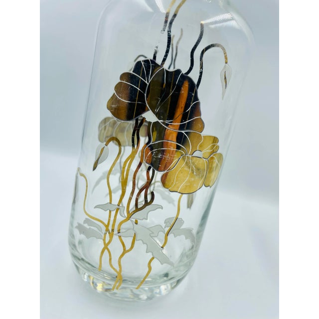 A wonderfully opulent cocktail set that is sleek and sweet! This mid-century glam "Golden Orchids" motif Decanter and Ice...