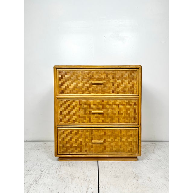 Vintage rattan 3 drawer chest of drawers nightstand. Woven reed with rattan frame, on split reed rattan base. Classic...