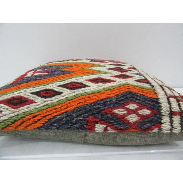 This is a pillow cover made from a vintage kilim rug. The piece was properly washed and ready to use. Pillow inserts not...