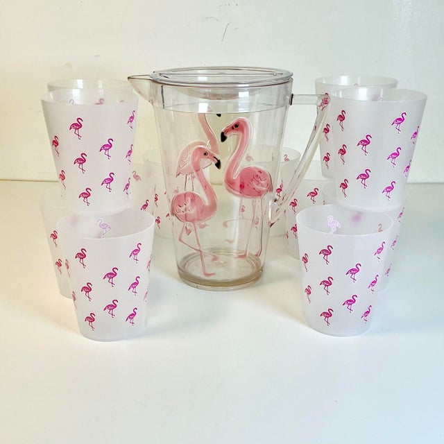 This Flamingo themed Pitcher & Glasses Set is whimsical and fun. It features a clear Lucite/Acrylic Pitcher with four pale...