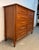 A stunning example of American mid-century craftsmanship, this ten-drawer walnut dresser by Davis Cabinet Company combines...