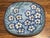 This is a Ken Edwards "El Palomar" Blue Floral Pottery Platter. The mark on the bottom identifies it as part of the "El...